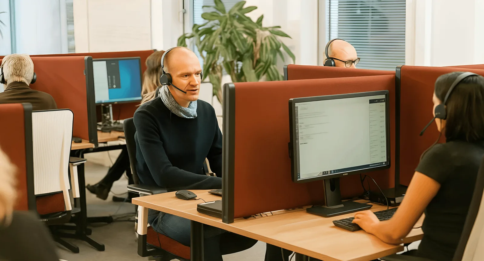 An experienced BDC team for car dealerships collaborating in a modern office